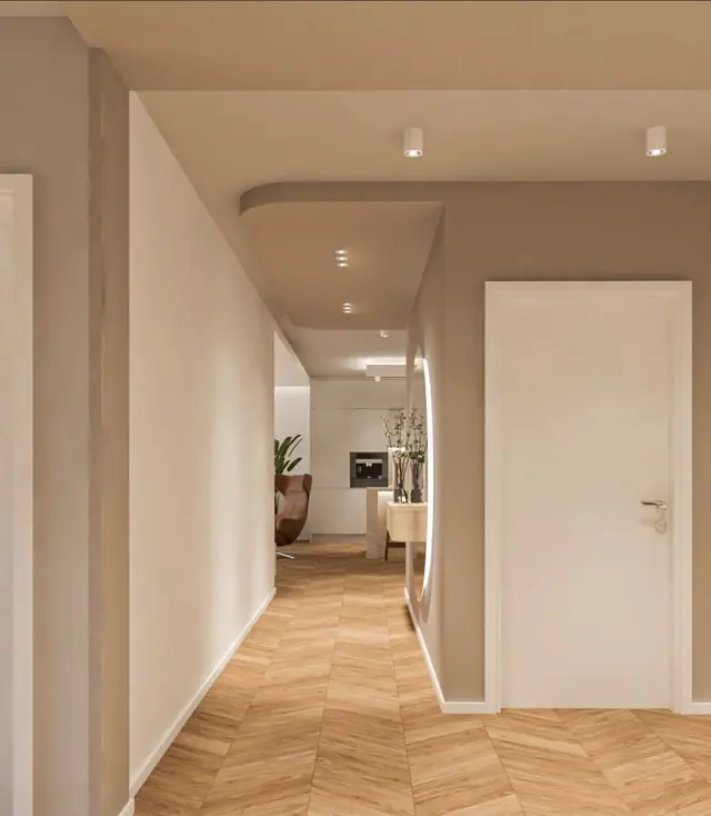 Couloir peint en taupe avec parquet à chevrons